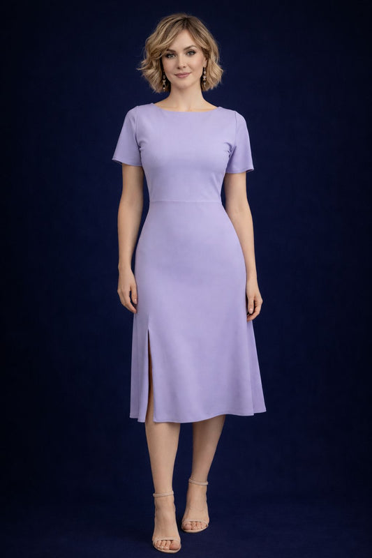 Woman wearing a lilac tango dress with flowing tale, front view