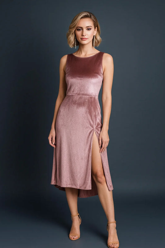 Woman wearing a dusty rose tango dress against a dark background, front view.