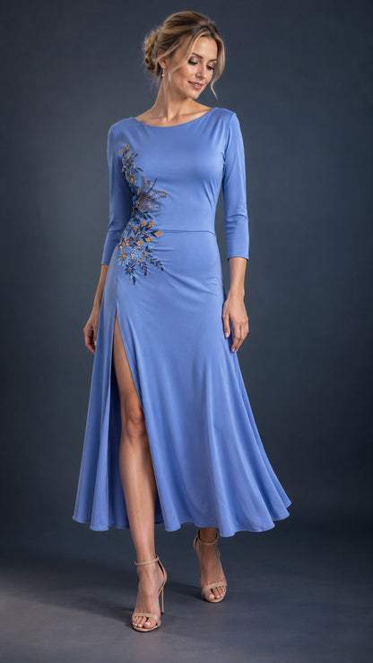 Light blue women’s tango dress with three-quarter sleeves, a high side slit, flowing midi skirt and floral embroidery, designed for Argentine tango dancing.