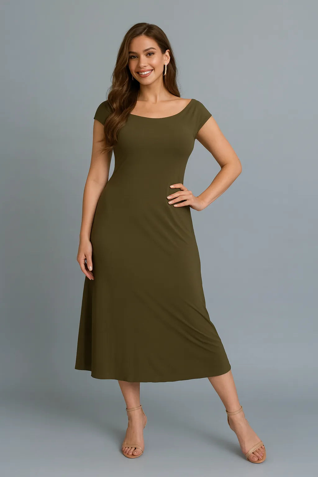 Woman wearing an olive green tango dress against a gray background