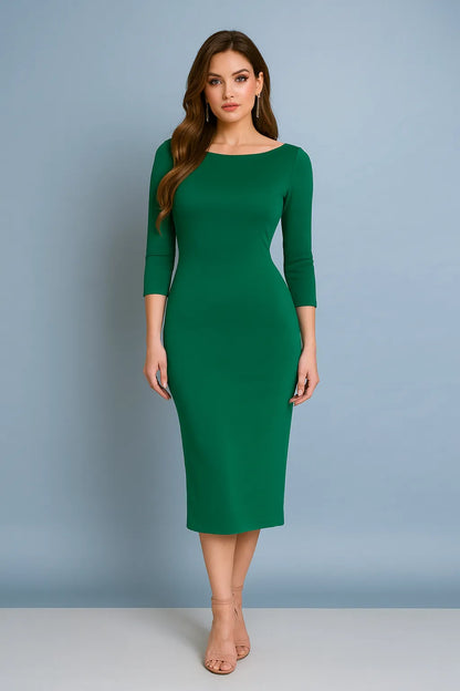 Woman wearing a green tango dress against a gray background