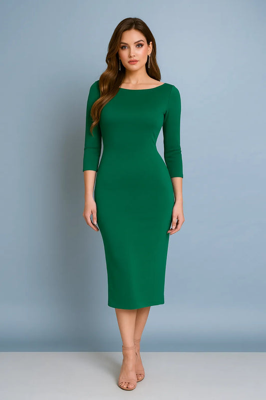 Woman wearing a green tango dress against a gray background