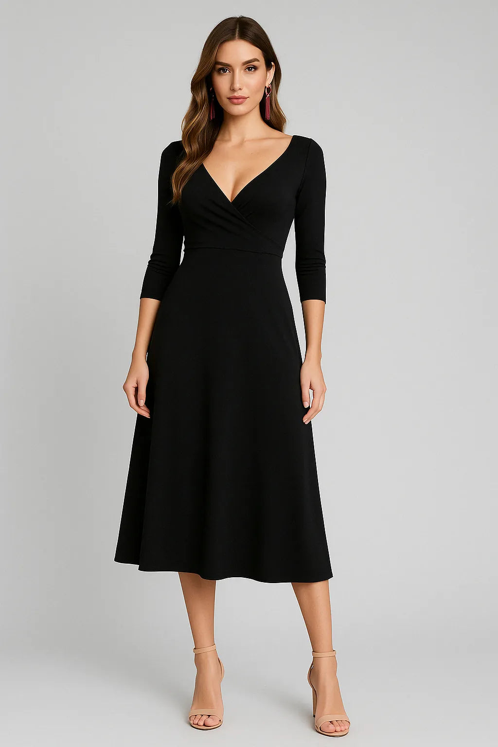 Woman wearing a black tango dress on a gray background