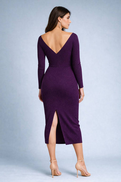 Woman wearing a purple long sleeved tango dress with a backless design, back view