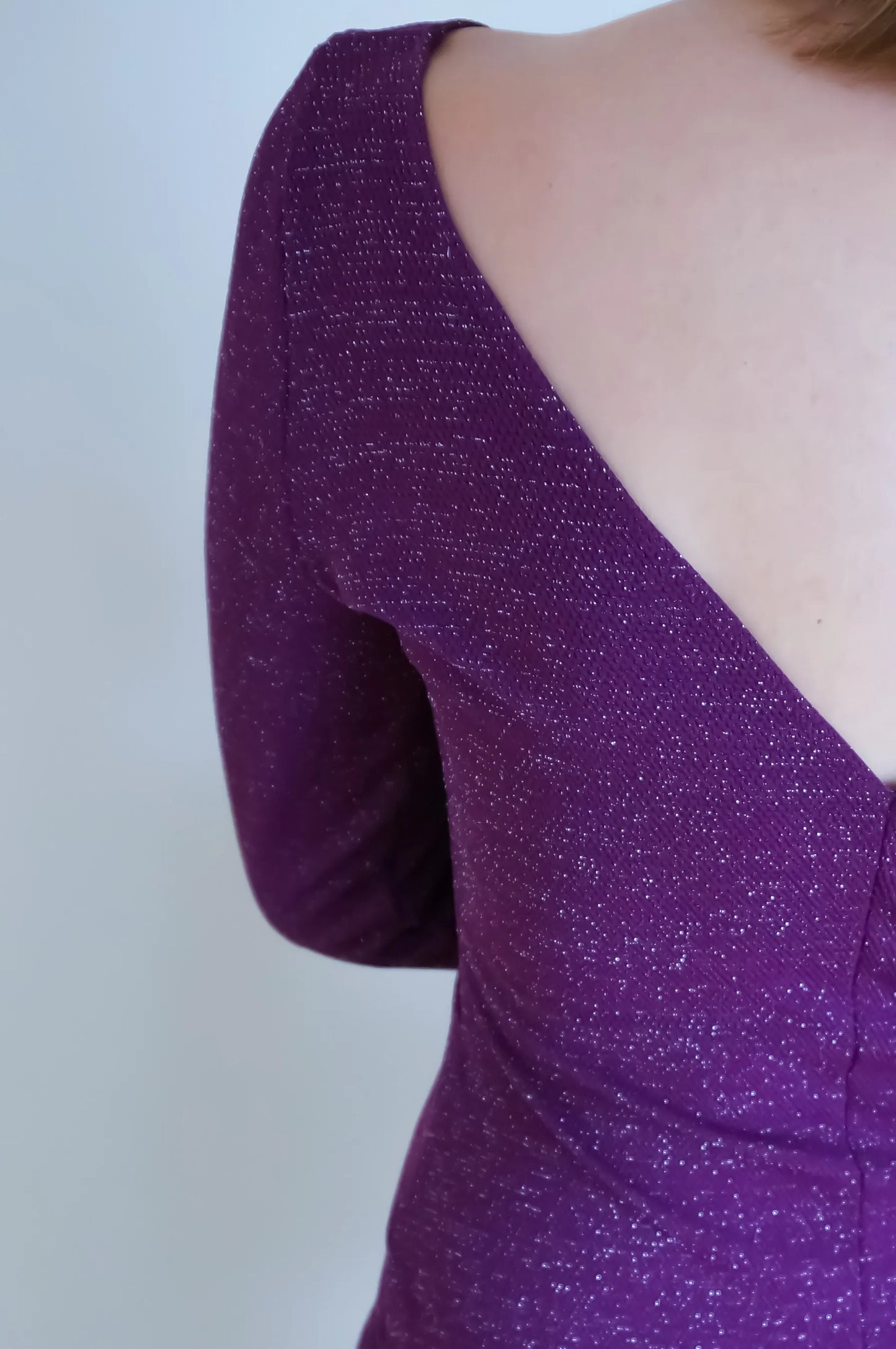Purple glittery tango dress with a V-neck, close-up
