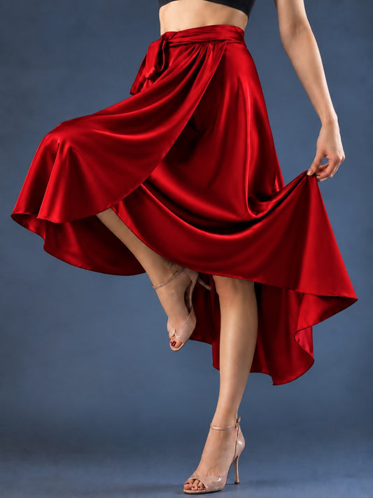 Front view of a women’s tango wrap skirt in flowing satin with a wide waistband, tie closure and asymmetric hem, designed for graceful movement in Argentine tango.