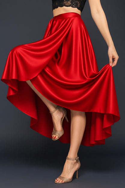 Wrap red tango skirt being twirled by a person on a dark background