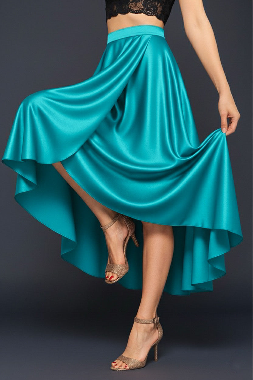 Turquoise tango skirt being twirled against a grey background