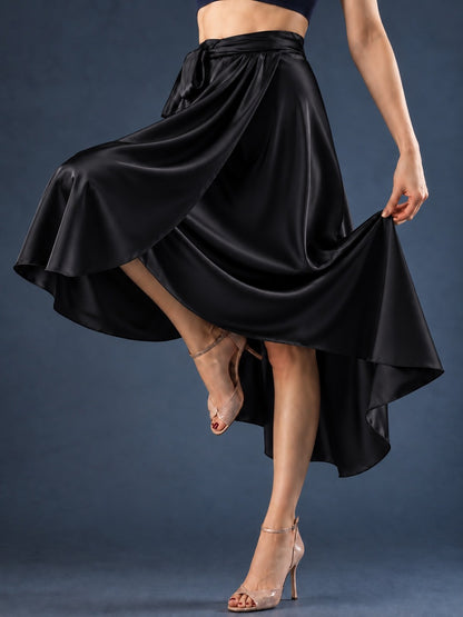 Front view of a women’s tango wrap skirt in flowing satin with a wide waistband, tie closure and asymmetric hem, designed for graceful movement in Argentine tango.