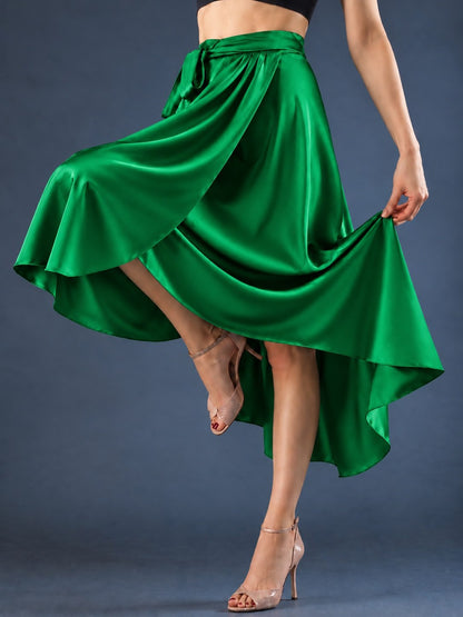 Front view of a women’s tango wrap skirt in flowing satin with a wide waistband, tie closure and asymmetric hem, designed for graceful movement in Argentine tango.