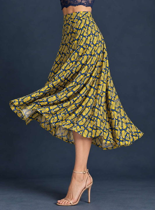 Women’s A-line tango skirt in silky printed jersey flowing outward in movement, with a wide waistband and full midi silhouette.