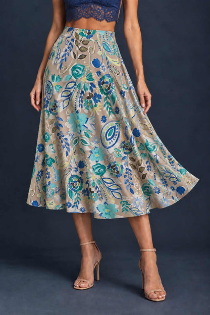 Women’s A-line tango skirt in silky jersey with a vibrant multicolor abstract print, wide waistband, and flowing midi silhouette.