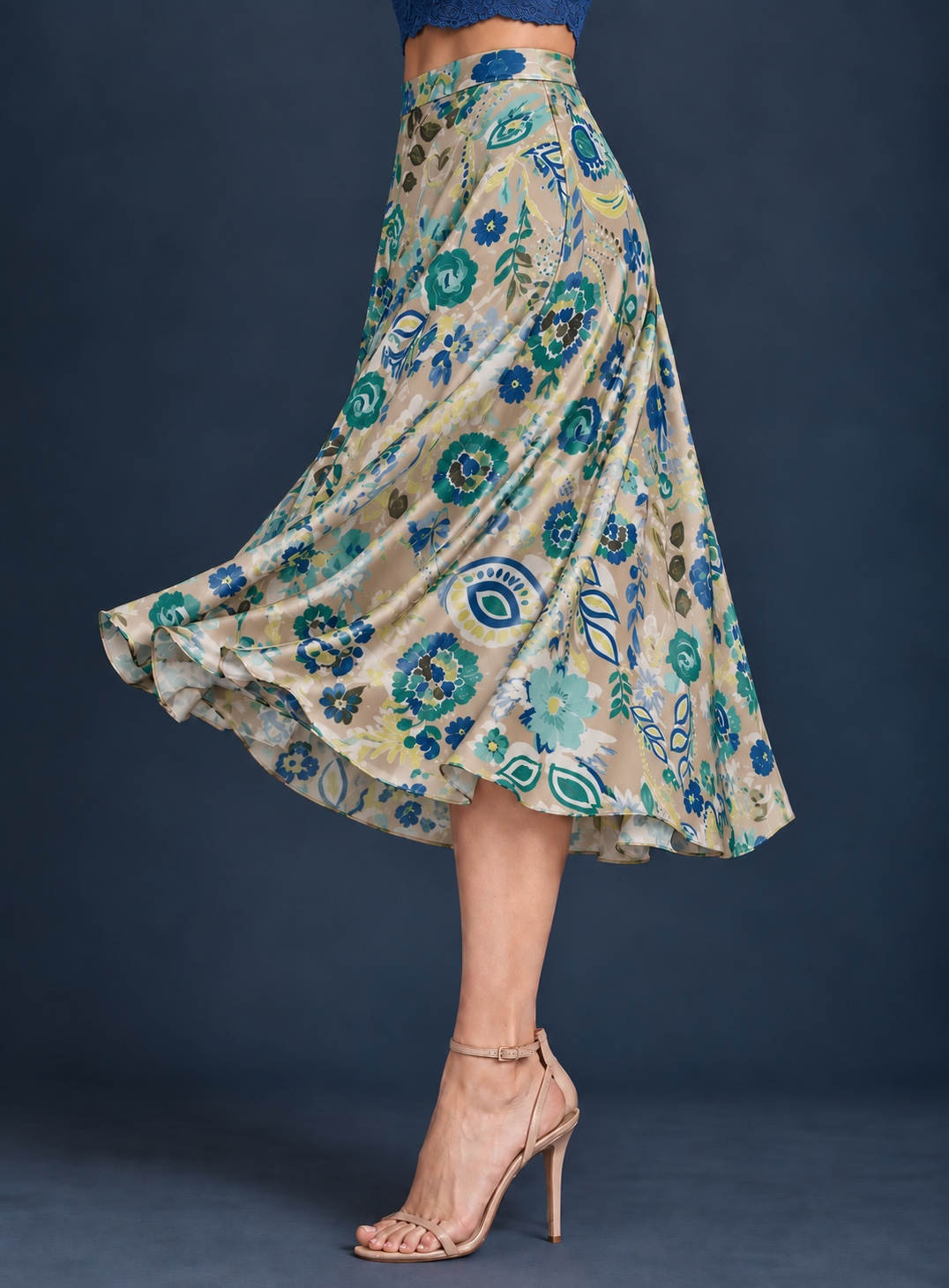Women’s A-line tango skirt in silky jersey with a vibrant multicolor abstract print, wide waistband, and flowing midi silhouette.