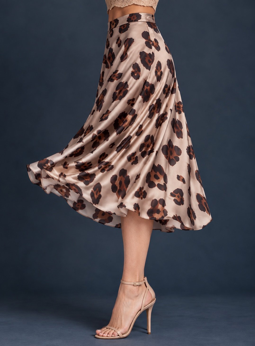 Women’s silky jersey tango skirt with leopard print and full A-line silhouette flowing outward in movement.