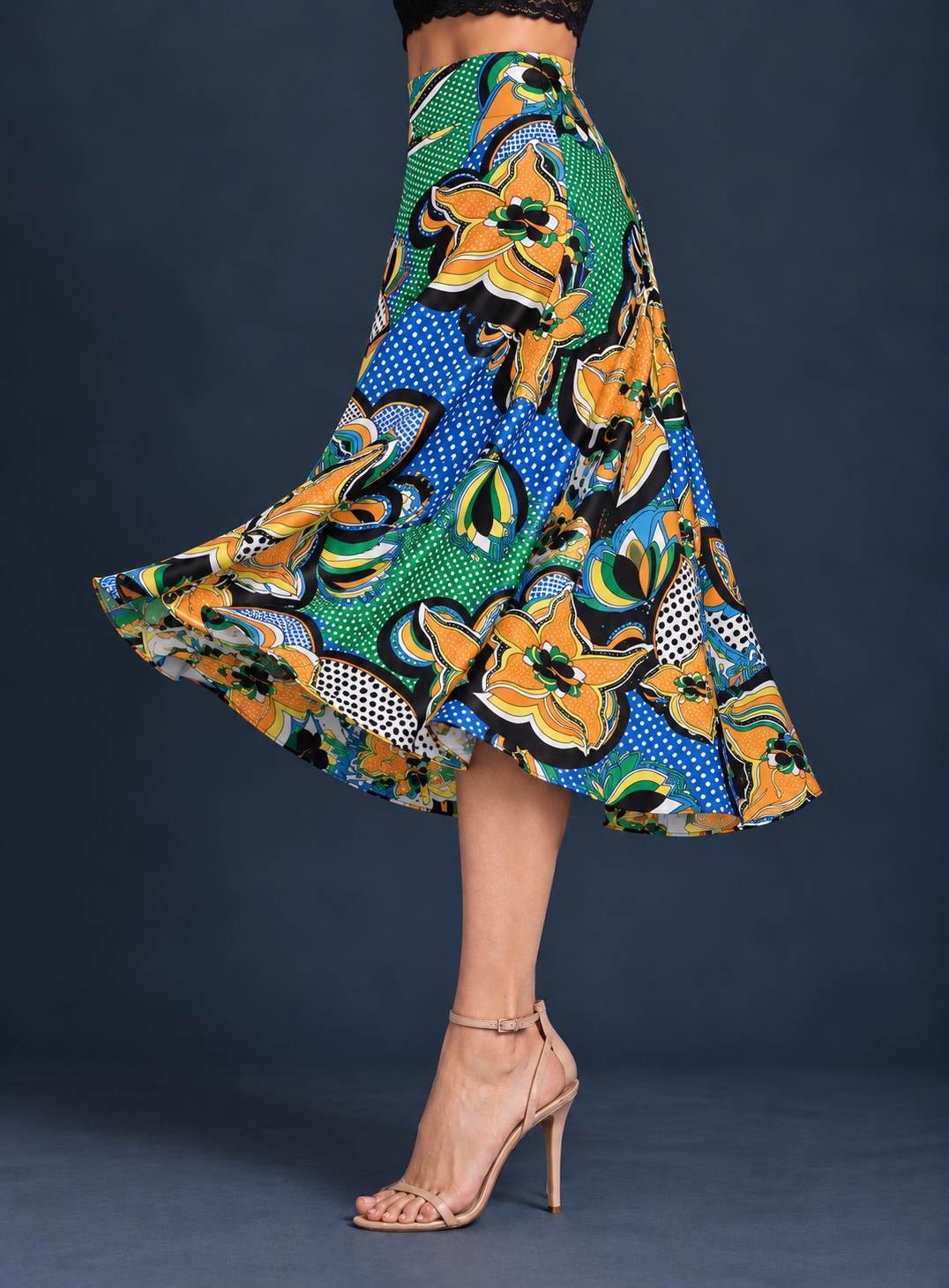 Women’s silky jersey tango skirt with a multicolor floral print, wide waistband, and full A-line silhouette flowing outward in movement.