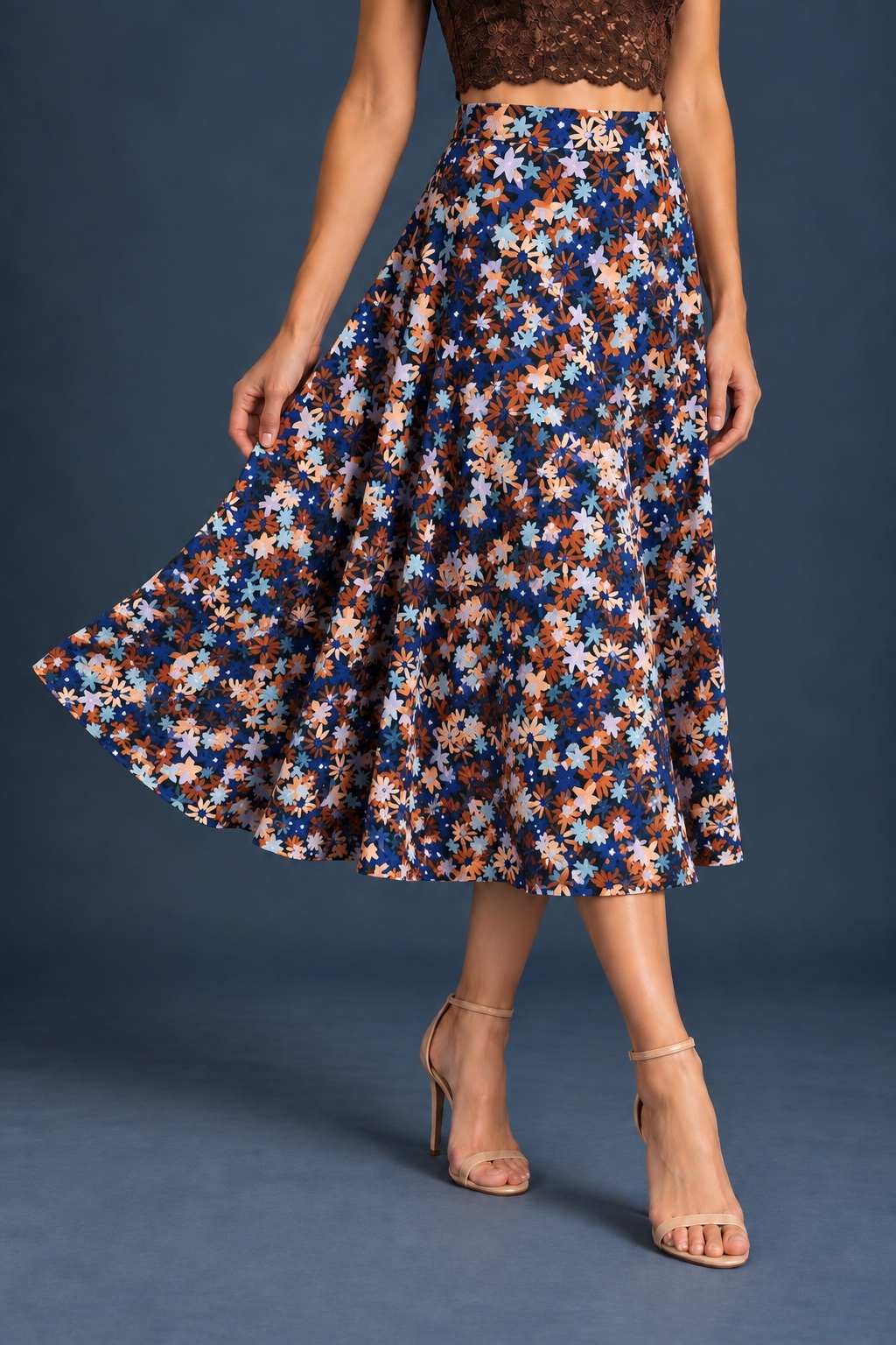 Women’s A-line tango skirt in silky jersey with a small multicolor floral print, wide waistband, and flowing midi silhouette.