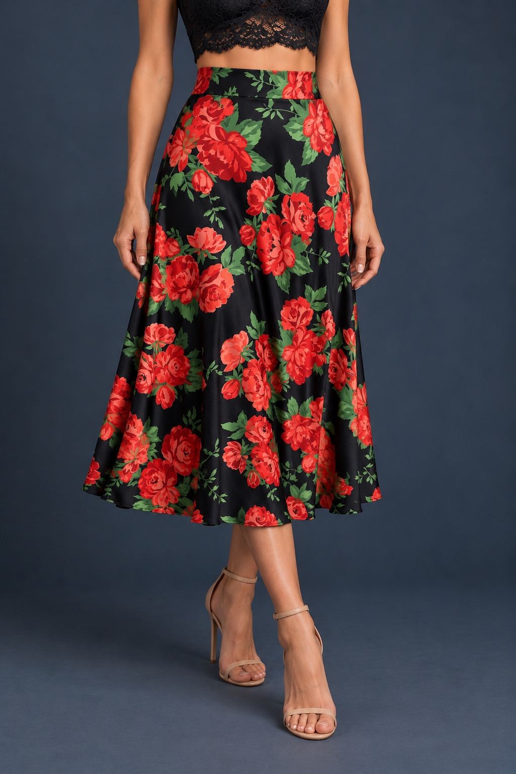 Women’s A-line tango skirt in silky jersey with red rose print on a black background, wide waistband, and flowing midi silhouette.