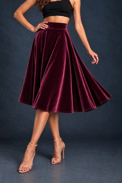Women’s smooth velvet tango skirt with a full A-line silhouette, wide waistband and midi length, designed for fluid movement and made in France.