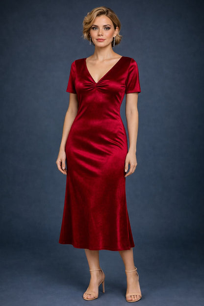 Woman wearing a red velvet tango dress, front view