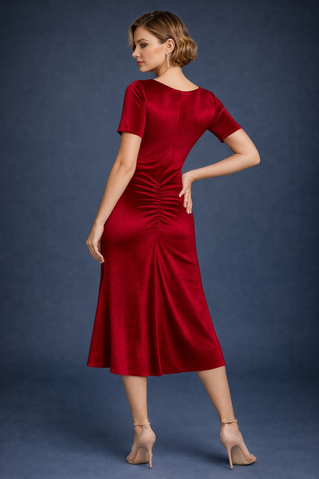 Woman wearing a red velvet tango dress, back view
