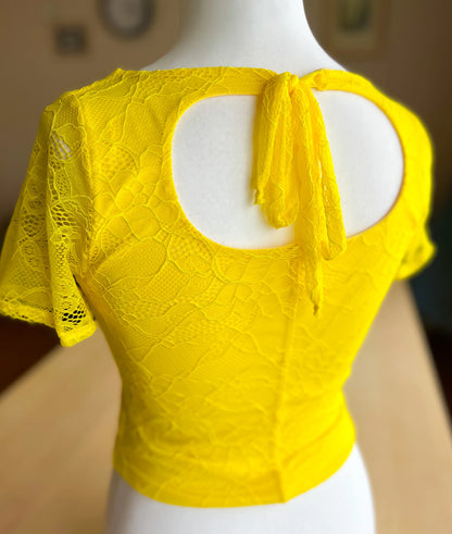 Romantic lace tango top with open back and ribbon tie