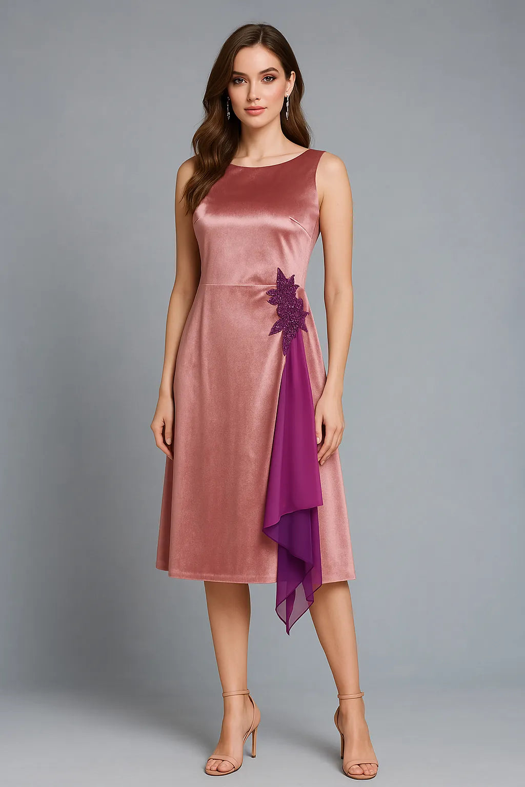 Woman wearing a pink satin tango dress with a purple accent on a gray background