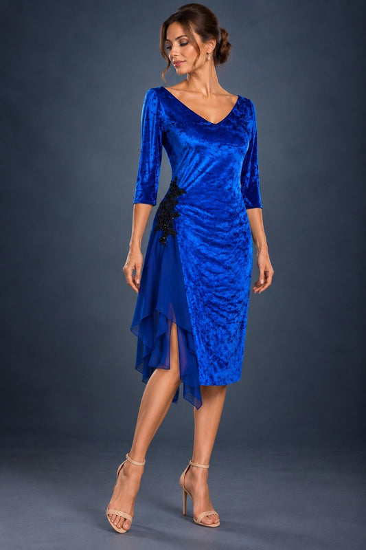 Front view of a royal blue women’s tango dress in marbled velvet with three-quarter sleeves, shimmering waist embroidery, a front leg slit and flowing chiffon godets.