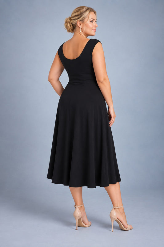 Black silky jersey tango dress in size XL with a wide flowing skirt and semi-open rounded back designed to cover a bra strap, back view.