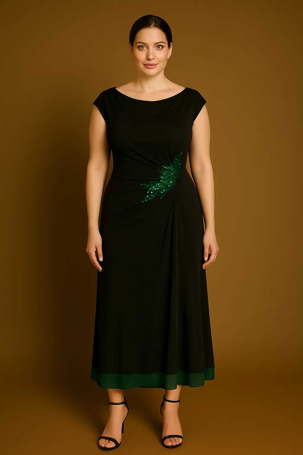 Woman wearing a black tango dress with a green feather detail on a brown background