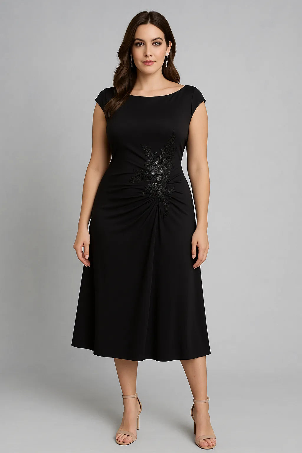 Woman wearing a black tango dress against a gray background