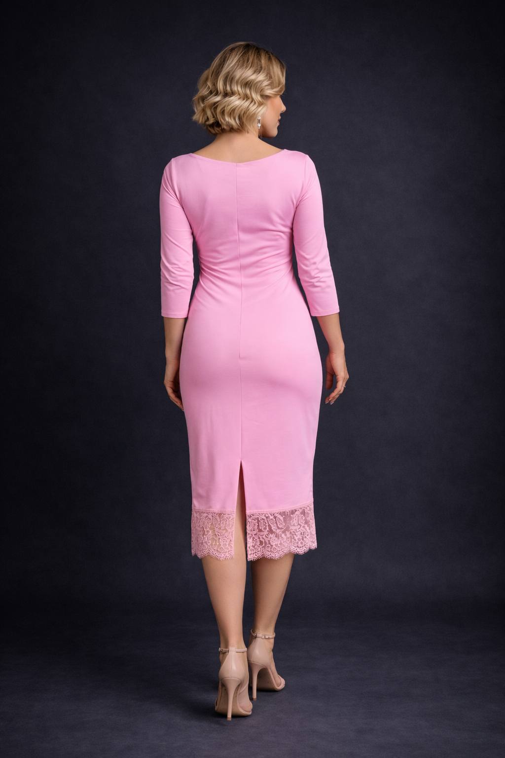 Woman wearing a cold rose tango dress with lace detailing, back view