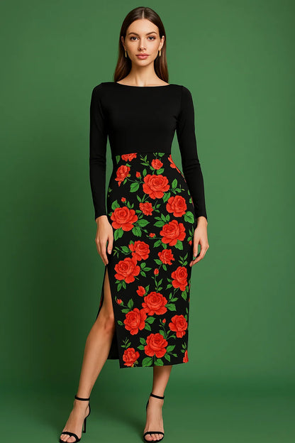 Woman wearing a black tango dress with red floral pattern on a green background