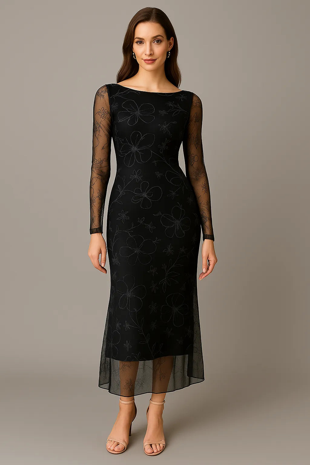 Woman wearing a black tango dress with sheer sleeves against a gray background