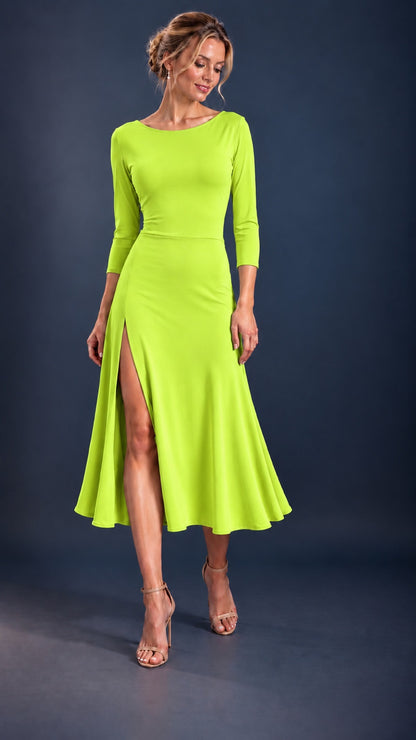 Front view of a vibrant lime green women’s tango dress with three-quarter sleeves, a flowing skirt and front leg slit, designed for Argentine tango dancing.