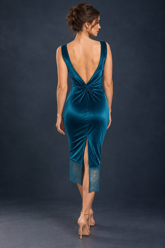 Back view of a fitted stretch velvet tango dress with a deep open back, decorative knot at the waist, central back slit and delicate lace hem.