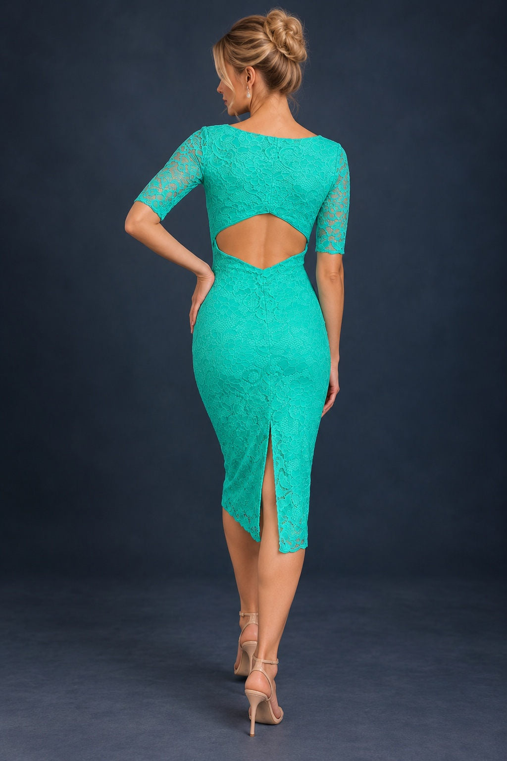 Back view of a women’s tango dress in floral stretch lace with a geometric open-back cutout, elbow-length sleeves and a back slit for freedom of movement.