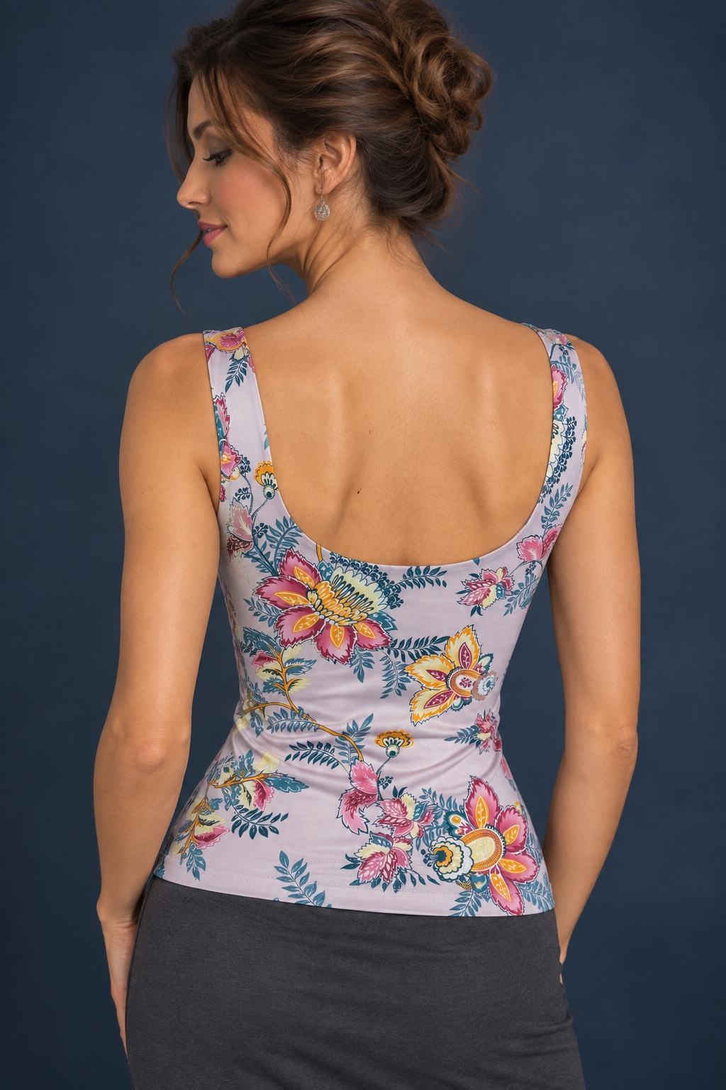 Back view of a floral silky jersey tango top with wide shoulder straps, a low rounded back and a fitted silhouette.