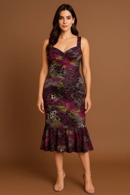 Woman wearing a floral and leopard print tango dress against a brown background