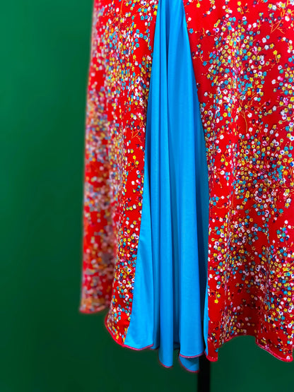 Turquoise-accented tango dress with flowing A-line silhouette