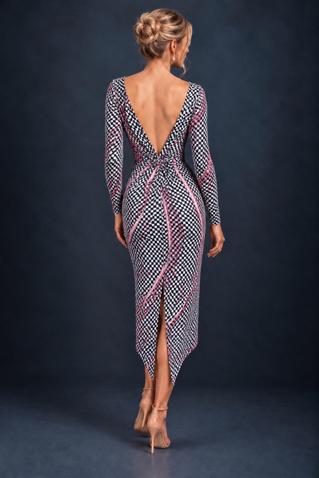 Back view of a women’s tango dress in silky textured stretch jersey with a deep V-shaped open back, decorative knot, asymmetric hem and back slit for freedom of movement.