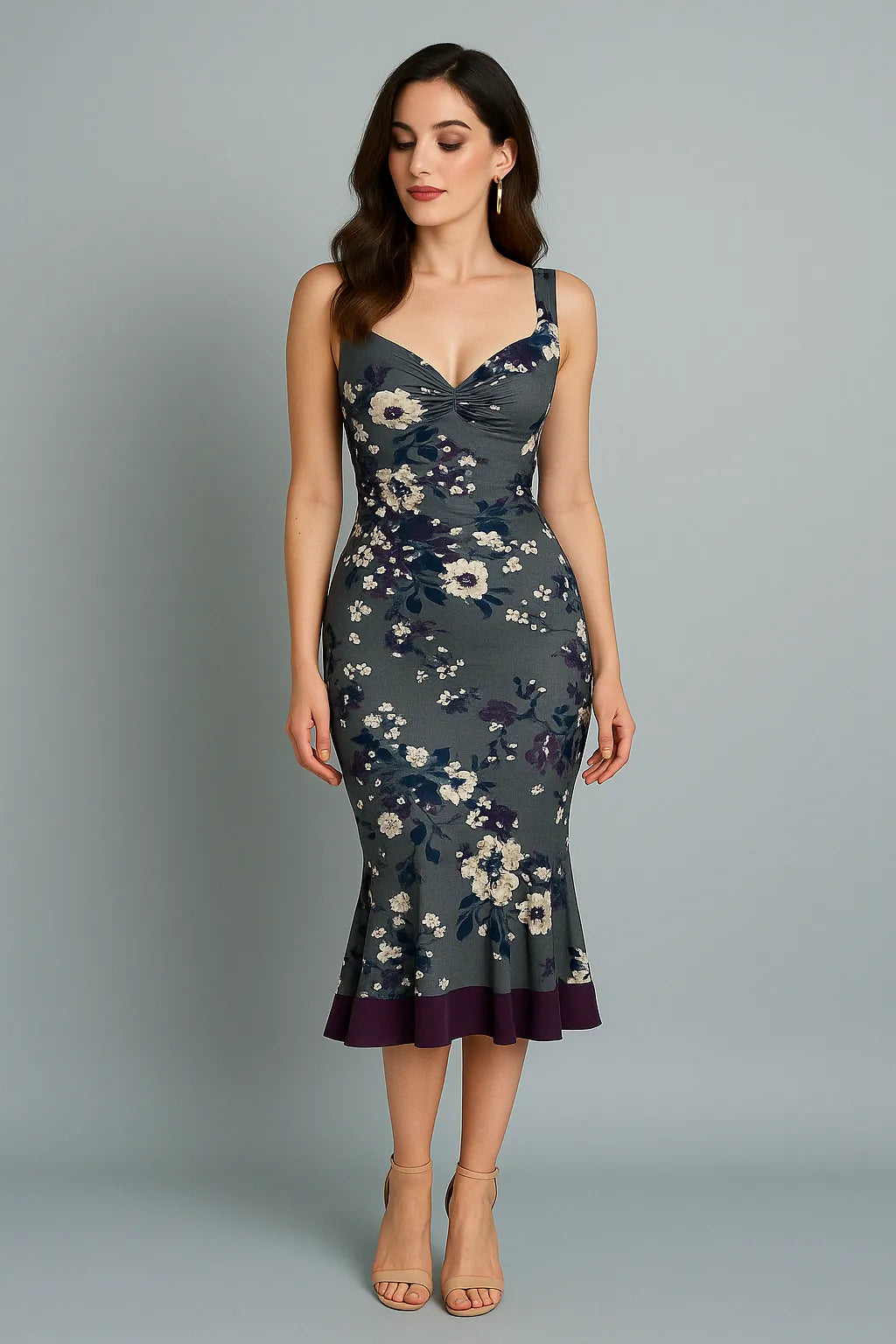 Woman wearing a floral tango dress against a gray background
