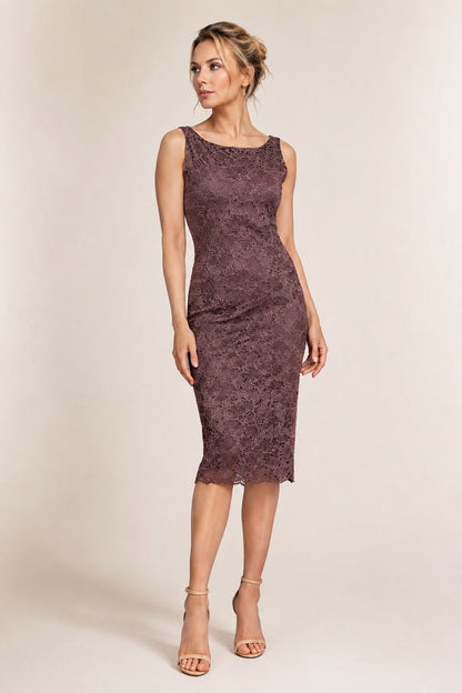 A woman modeling a sleeveless, knee-length lace dress in a muted plum-brown color, paired with beige high-heeled sandals, against a plain beige studio background.