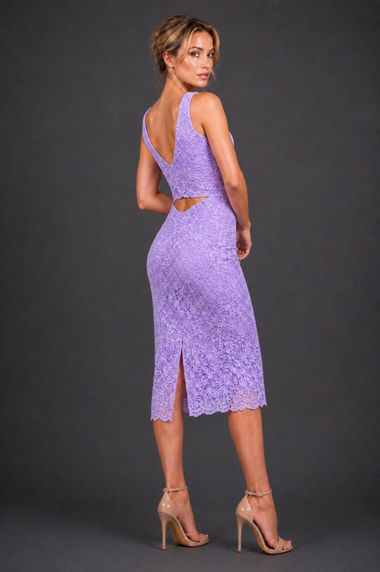 A woman modeling a lavender lace midi dress with a back cutout, shown from the back against a dark gray studio background.