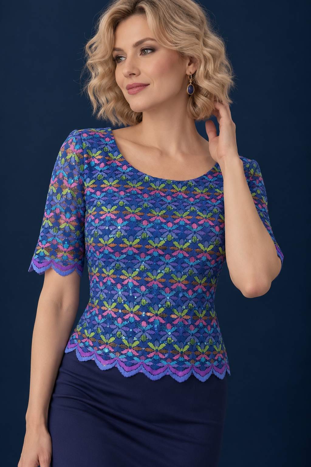Women’s tango top in shimmering multicolour lace with a lined bodice, semi-sheer short sleeves, scalloped edges and a fitted silhouette.