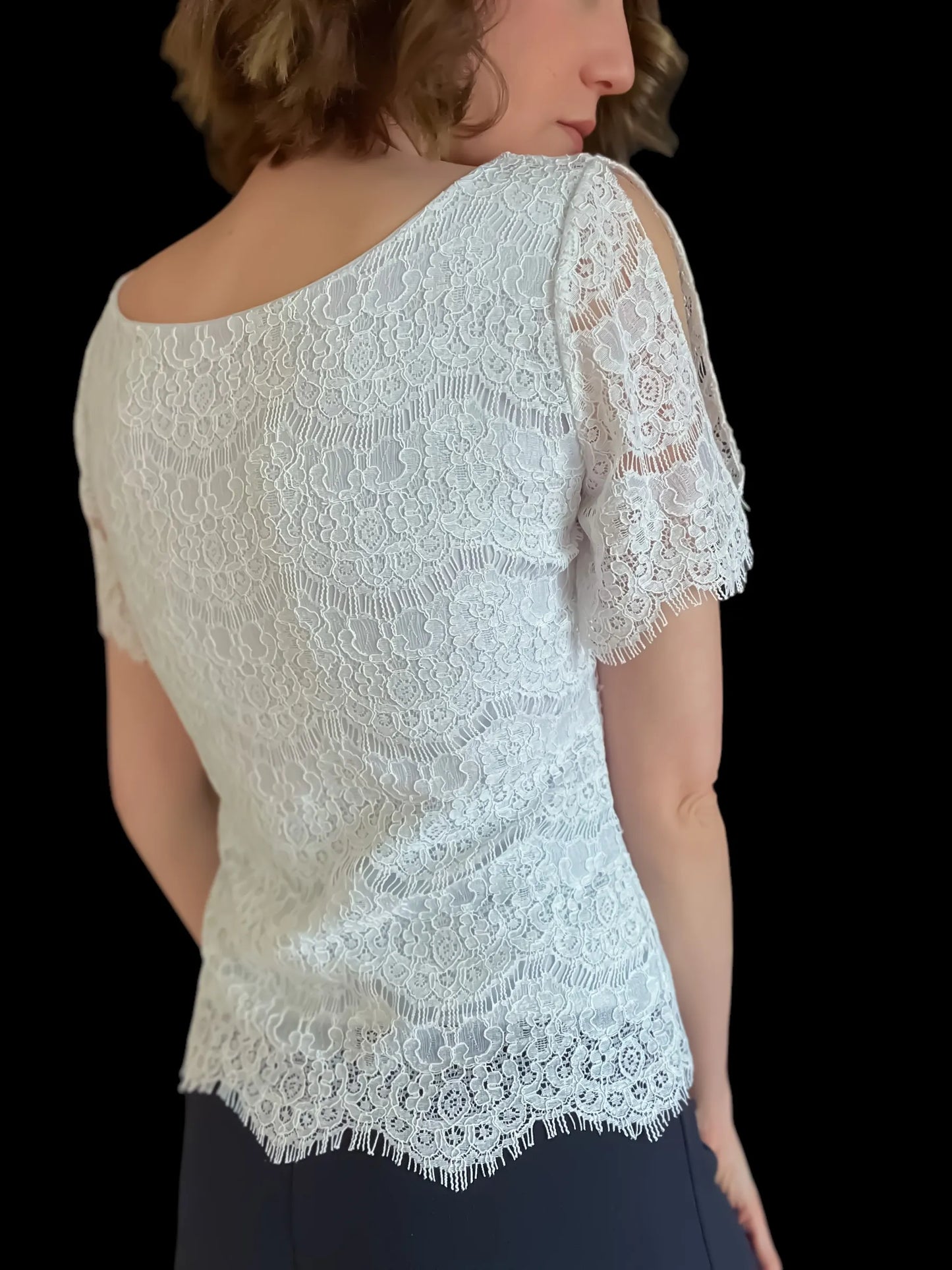 Elegant lace top with delicate draped sleeves