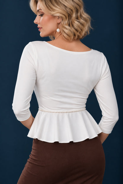 Back view of a white silky jersey tango top with three-quarter sleeves, fitted bodice, peplum waist and removable pearl belt.