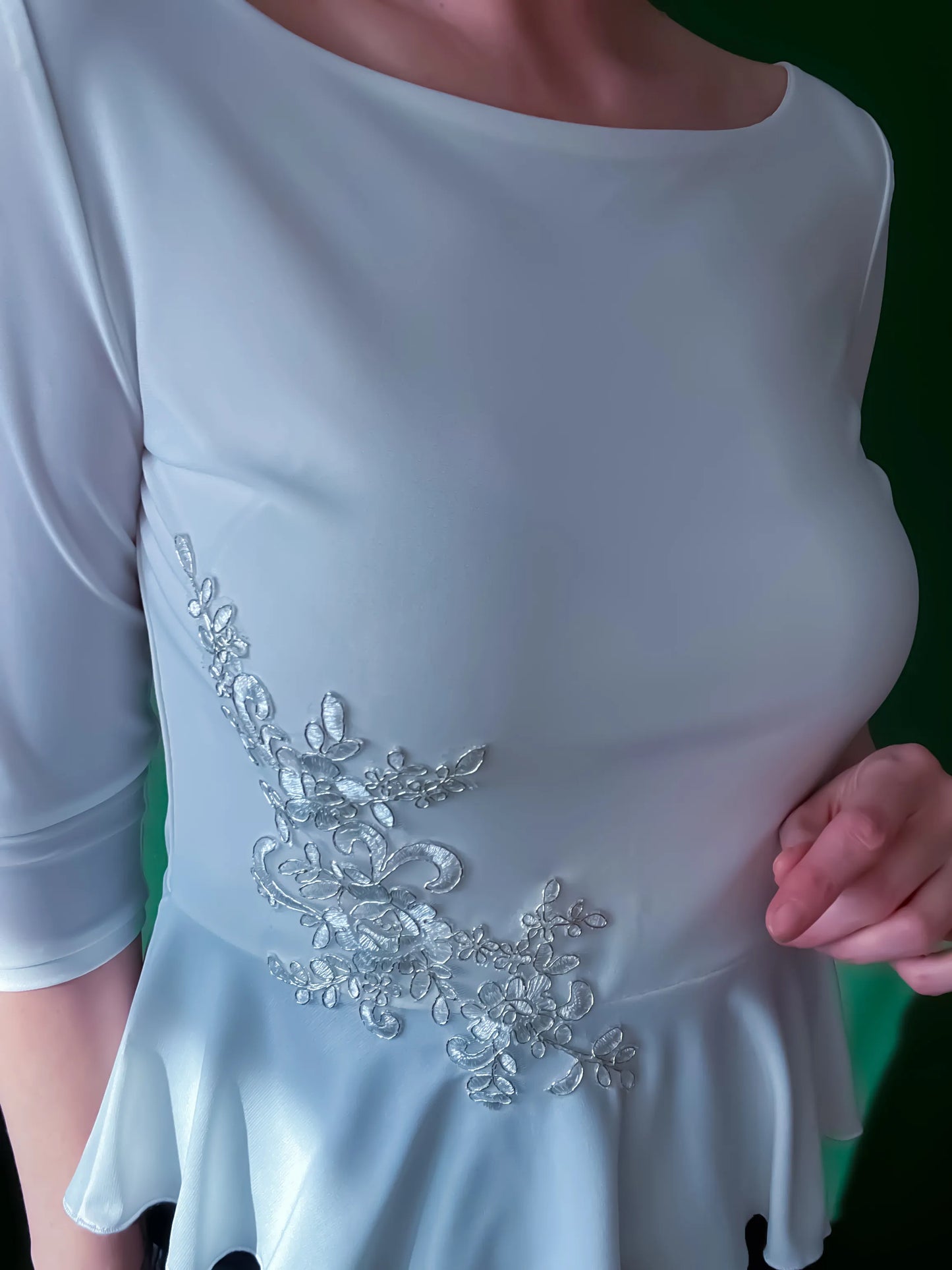 Feminine tango top with basque detail and shimmer accent