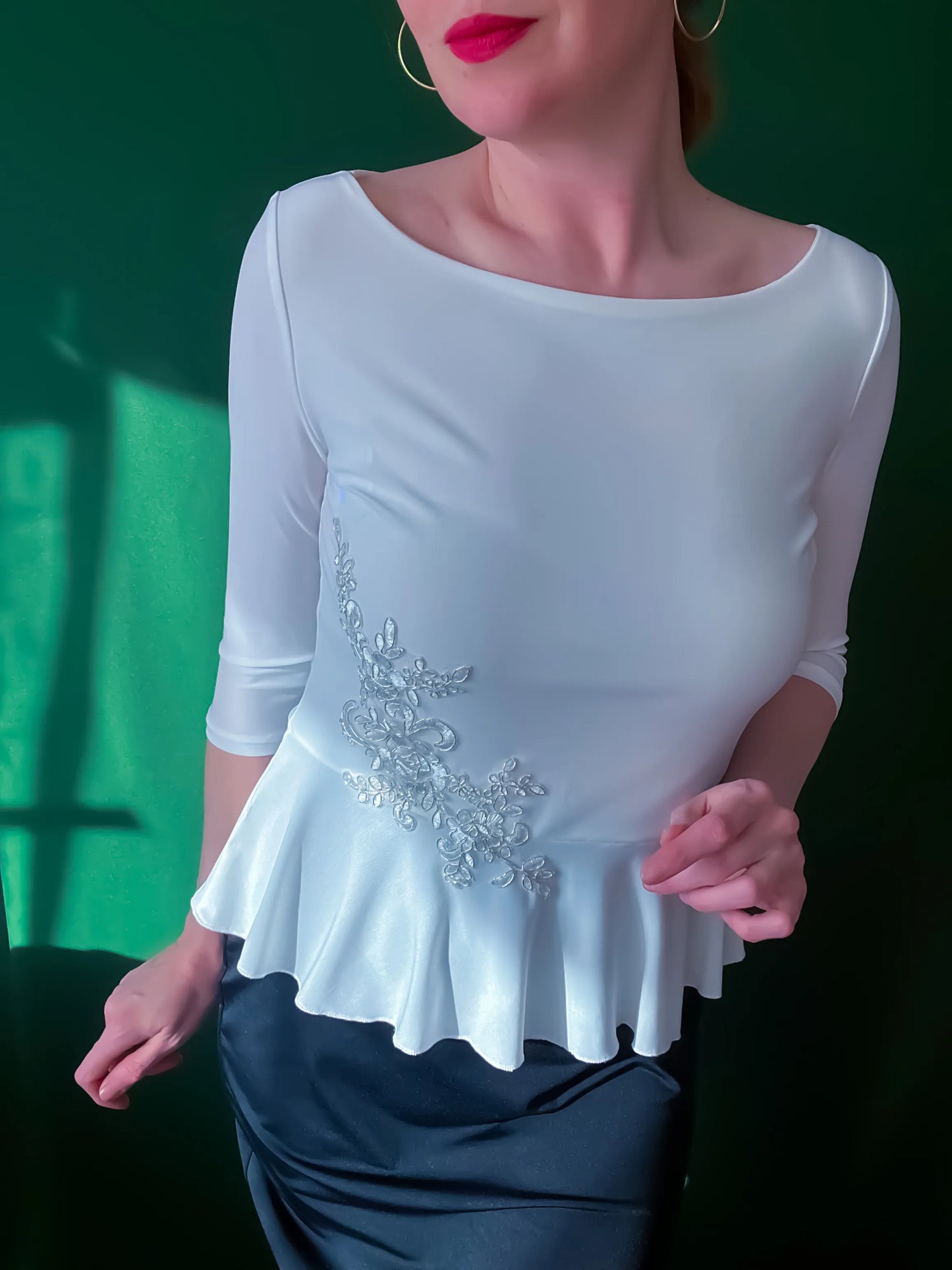 Feminine tango top with basque detail and shimmer accent
