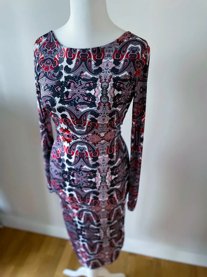 Elegant knit tango dress with deep v-back and knot detail