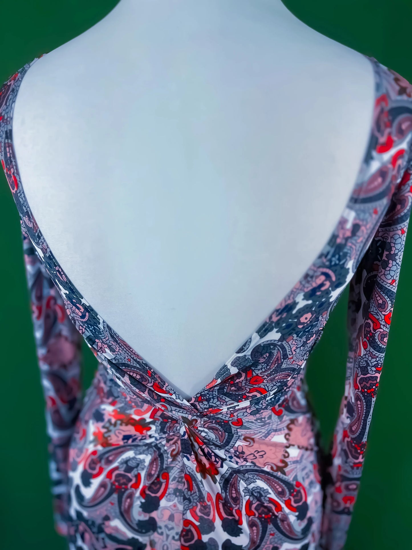 Elegant knit tango dress with deep v-back and knot detail